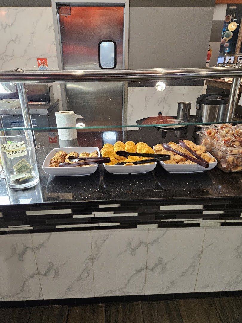Salad bar with fresh greens and toppings.